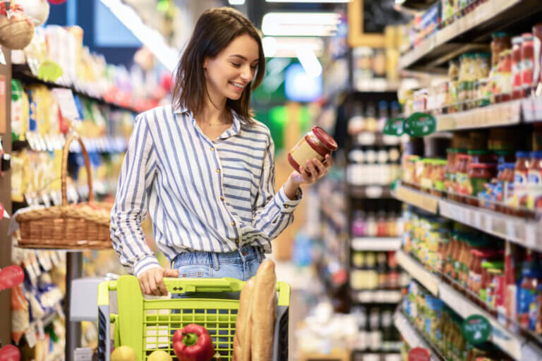 Image of customer looking over label on food container.