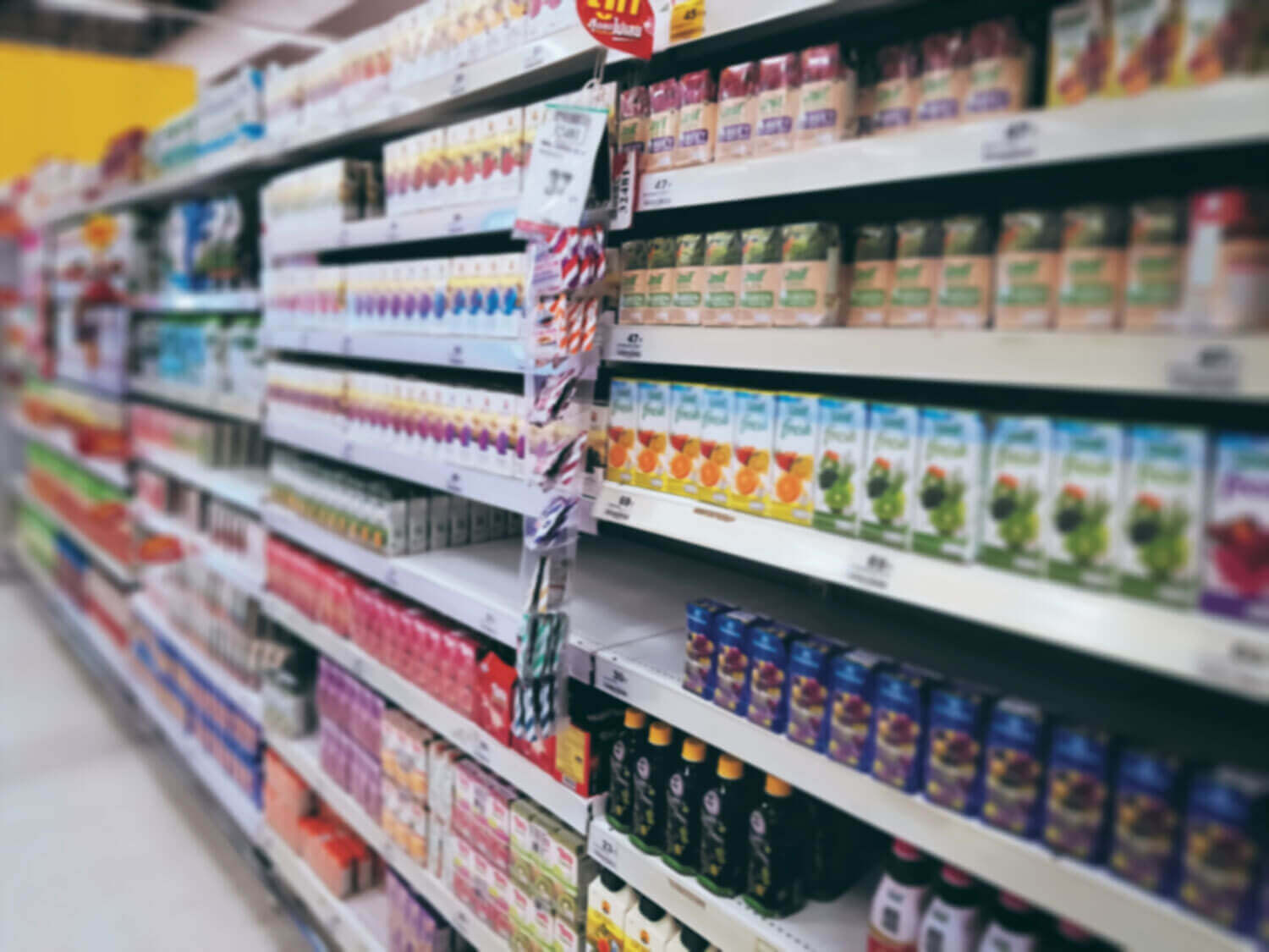 blurred background of juice boxes on shelves at gr 2023 11 27 04 58 32 utc
